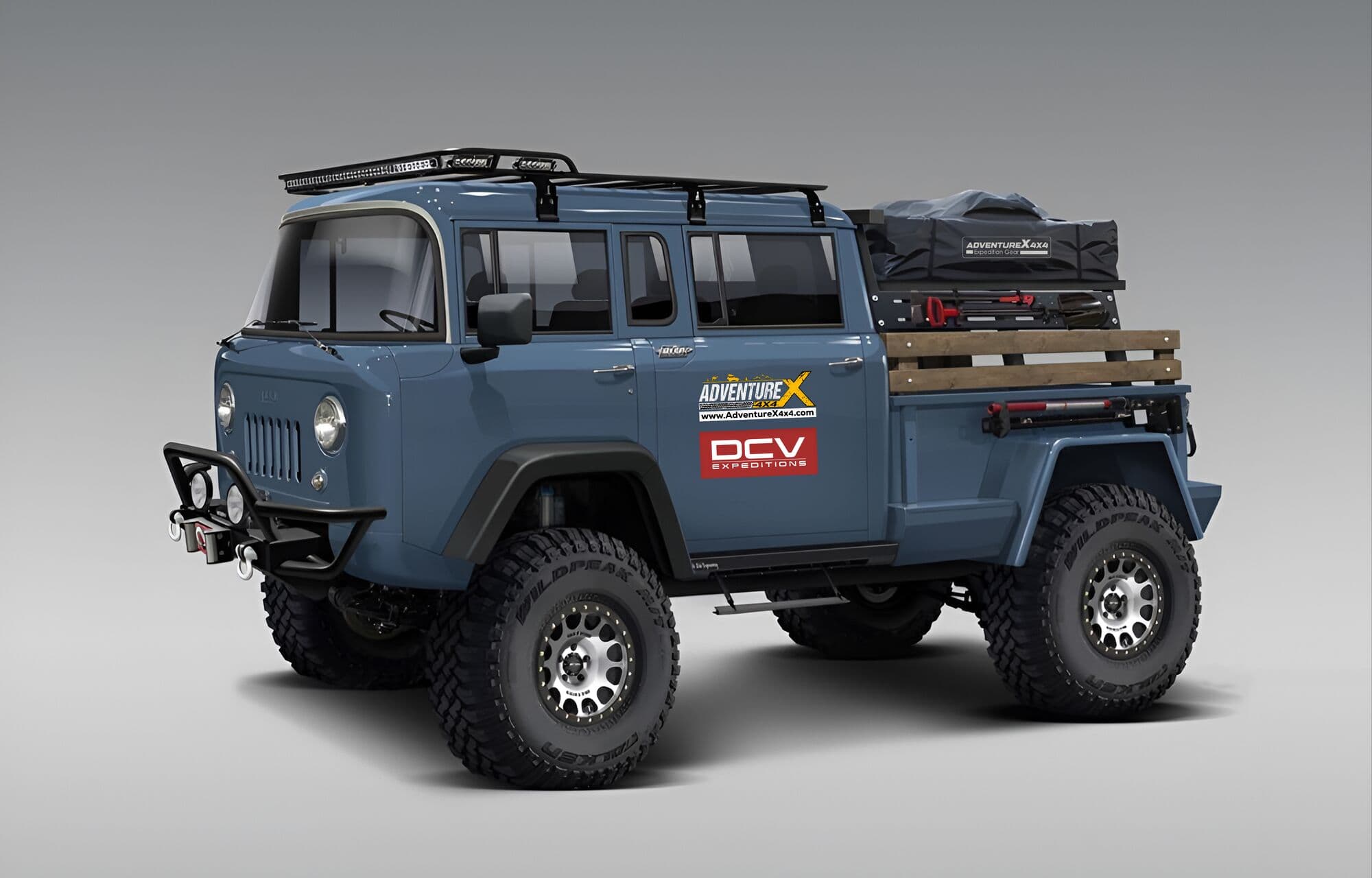 An AdventureX4x4 forward-control overland rig in brand livery